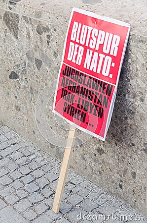 Protest sign placard anti-NATO rally demonstration against NATO Editorial Stock Photo